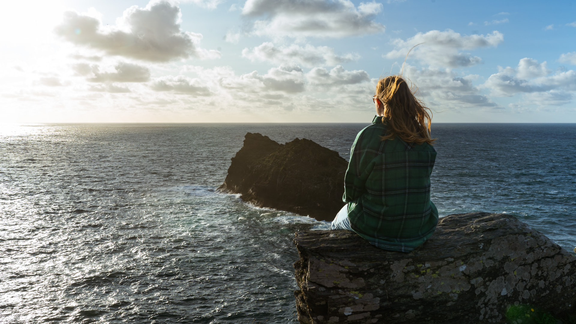 Sitting on the cliffs above Boscastle harbour, looking out to sea